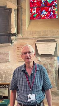 Colin Thorpe in front of the Chagall window