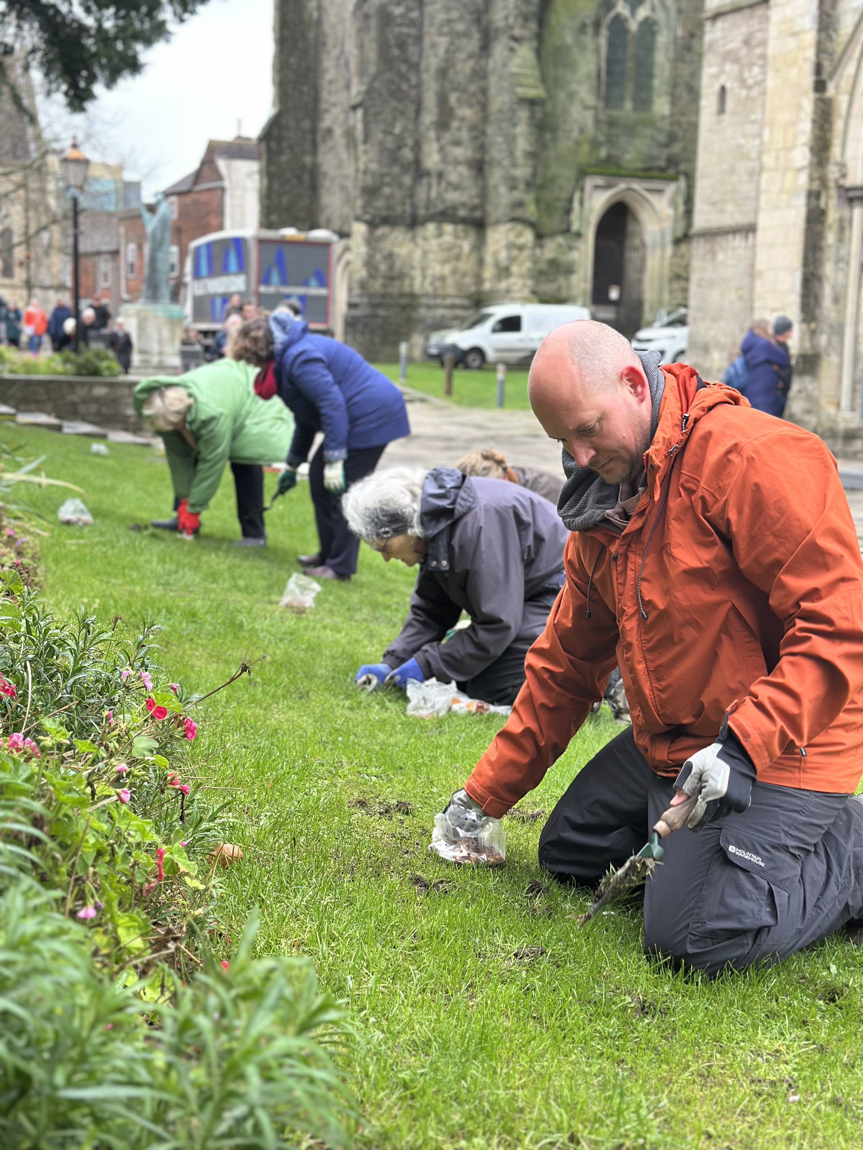 People planting bulbs