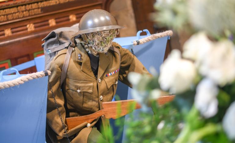 A soldier made from moss wearing uniform