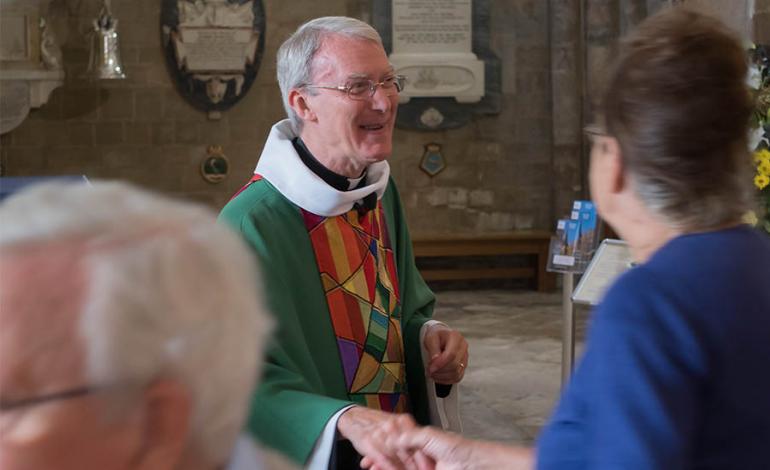 Canon Tim Schofield presiding over Sunday Eucharist