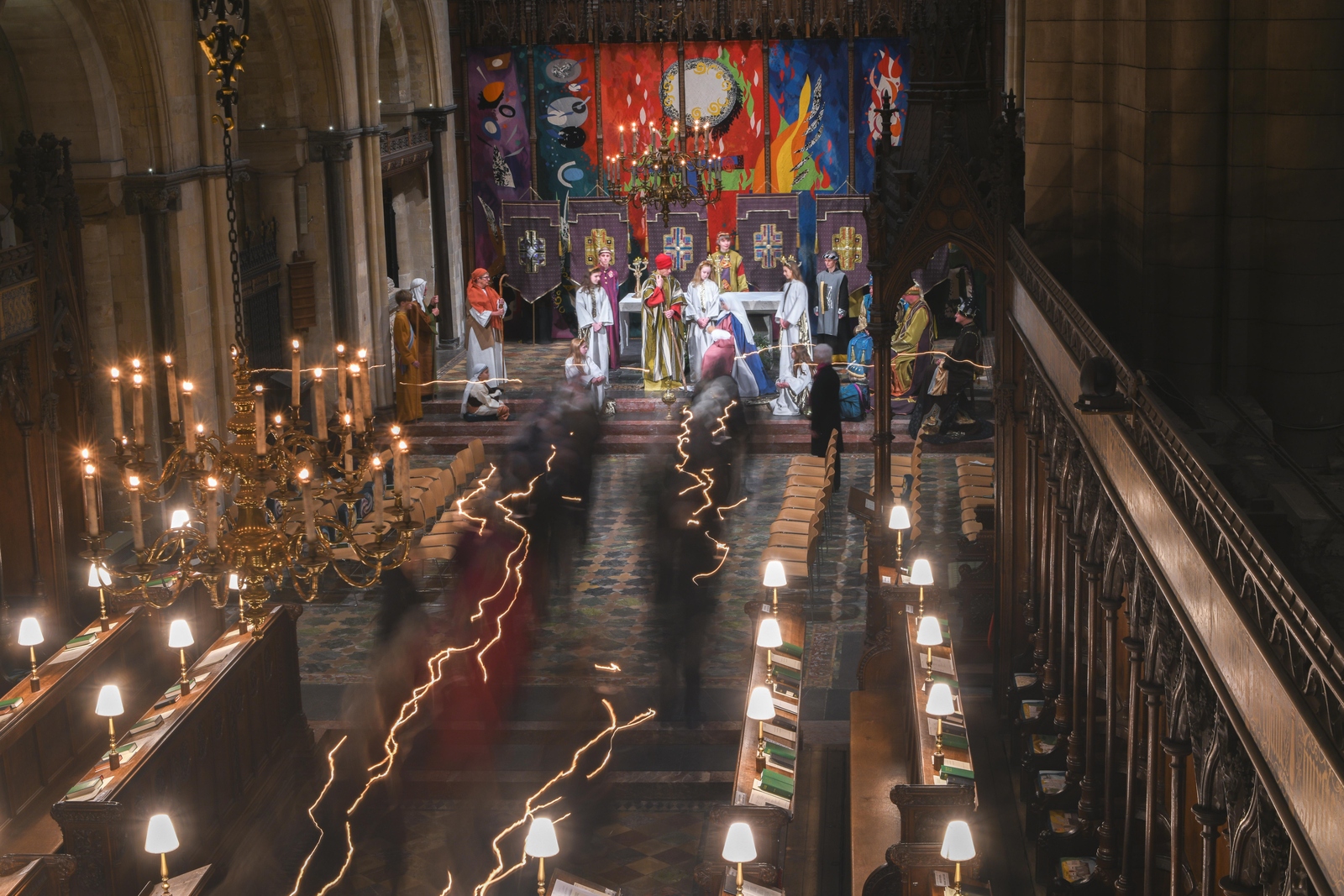 People process to the high altar to the nativity scene 